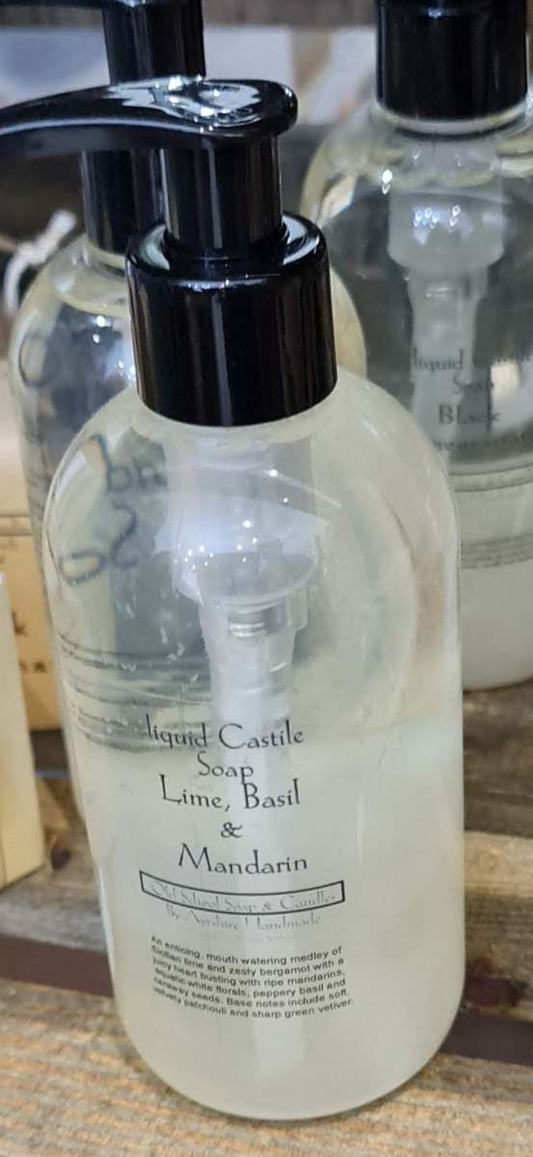 a bottle of soap sits on a wooden table