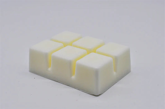 a white square of wax on a white surface