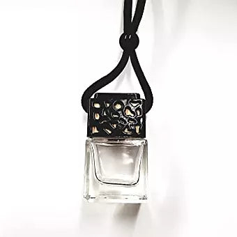 a black necklace with a white perfume bottle