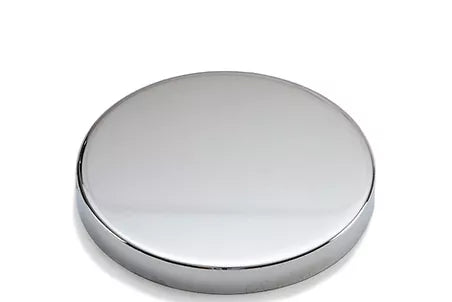 a round metal object on a white background
