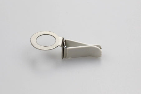 a white metal clip with a ring on it