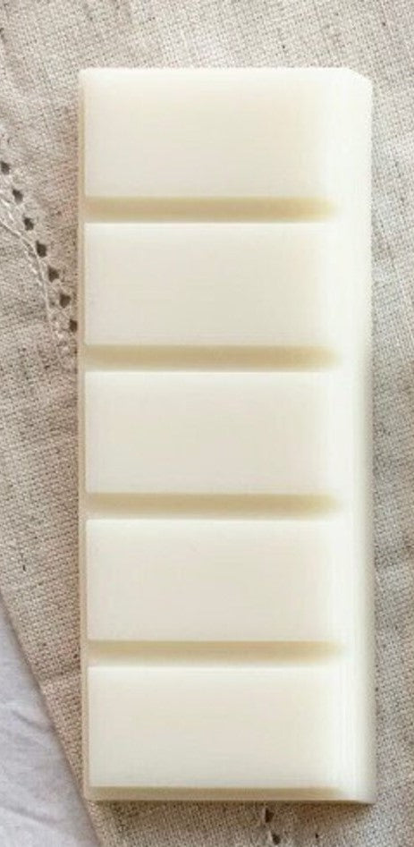 a close up of two white soap bars
